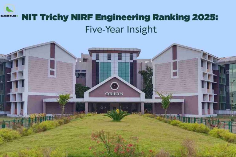 This image features the prominent Orion building at NIT Trichy, an academic structure distinguished by its symmetrical modern architecture, pastel pink-and-white exterior walls, and vertical glass panels in the central section. The building’s entrance sits below a gable roof with a circular emblem and the word “ORION” displayed in large, white letters, while the flanking blocks rise four stories with box-framed windows. In the foreground is a manicured lawn with a central cycad plant and scattered flowering shrubs, bordered by a low fence and edged with well-kept greenery. The scene conveys an atmosphere of order and academic excellence within the NIT Trichy campus. The image also includes the Career Plan B logo (a green bird inside a yellow circle) at the top left, and is overlaid with bold text at the top reading “NIT Trichy NIRF Engineering Ranking 2025: Five-Year Insight,” signifying a detailed analysis of the institute’s engineering ranking performance over the past five years.