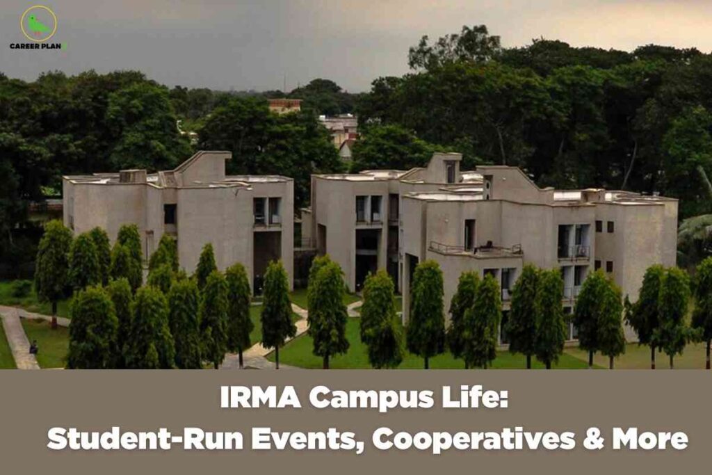 Modern concrete residential complex with multiple stories and balconies surrounded by landscaped green lawns and uniformly planted trees under cloudy sky displaying white text "IRMA Campus Life Student-Run Events Cooperatives & More" with Career Plan B logo representing Institute of Rural Management campus environment and community-based learning experience