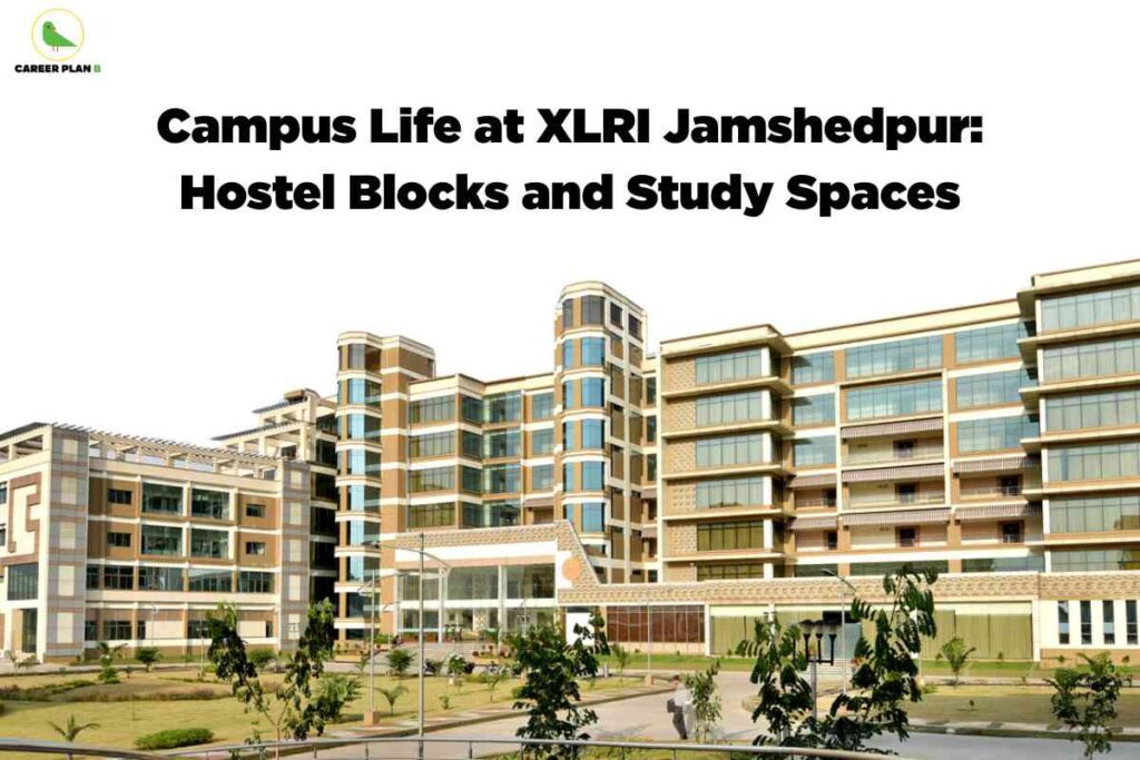 A high-resolution photo of the XLRI Jamshedpur campus shows a sprawling, modern academic building with a mix of tan and white colors, large glass windows, and multiple levels. The architectural style features rounded vertical columns and open terraces. The building is set amid landscaped grounds with trimmed lawns, small trees, bushes, and paved walkways. A few people are visible walking along the paths, contributing to a sense of campus life. The upper left corner has the Career Plan B green bird logo and name. Centered at the top, bold black text says, "Campus Life at XLRI Jamshedpur: Hostel Blocks and Study Spaces." The scene communicates a lively, well-maintained environment ideal for student accommodations and study.