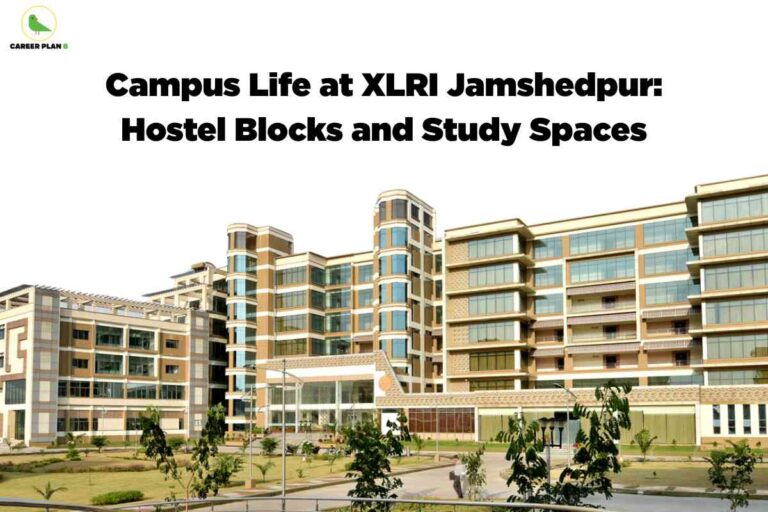 A high-resolution photo of the XLRI Jamshedpur campus shows a sprawling, modern academic building with a mix of tan and white colors, large glass windows, and multiple levels. The architectural style features rounded vertical columns and open terraces. The building is set amid landscaped grounds with trimmed lawns, small trees, bushes, and paved walkways. A few people are visible walking along the paths, contributing to a sense of campus life. The upper left corner has the Career Plan B green bird logo and name. Centered at the top, bold black text says, "Campus Life at XLRI Jamshedpur: Hostel Blocks and Study Spaces." The scene communicates a lively, well-maintained environment ideal for student accommodations and study.