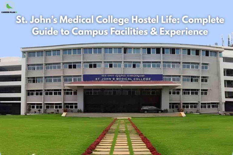 Front view of St. John’s Medical College building, a modern multi-story structure with rows of glass windows and a large entrance canopy. A well-maintained green lawn with a paved walkway and red flower borders leads up to the entrance. The Career Plan B logo is at the top left, and across the sky, bold white text reads 'St. John’s Medical College Hostel Life: Complete Guide to Campus Facilities & Experience.'